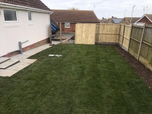 Indian Sandstone Patio with Railway Sleepers and New Lawn in Whitstable