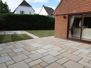 Indian Sandstone Patio with New Lawn in Ashford, Kent