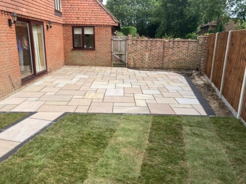 Indian Sandstone Patio with New Lawn in Ashford, Kent