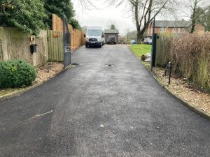 Tarmac Driveway with New Fence and Sleeper Wall in Challock, Ashford
