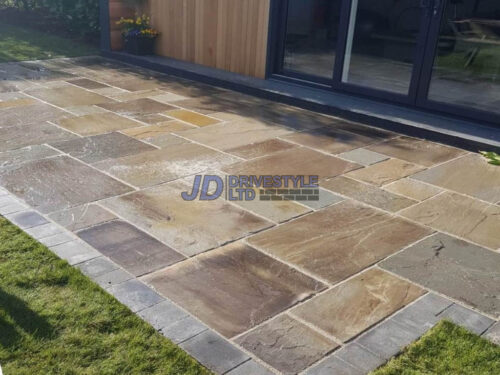 Indian Sandstone Patio with New Grass Lawn in Ashford, Kent