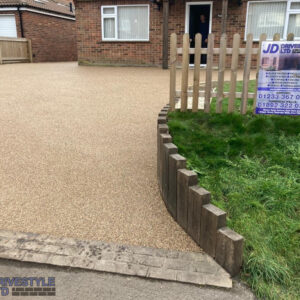 Resin Driveway with Sleeper Wall in Merstham