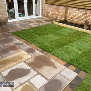 Sandstone Patio with Brick Border, Sleepers and Roll-On Turf in Faversham