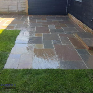 Slabbed Patio with Doorstep and Sleeper Flower Bed in Canterbury