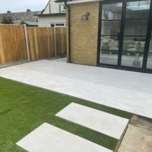 Patio with Porcelain Slabs and Artificial Grass in Whitstable, Kent