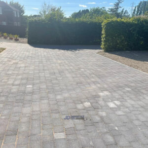 Tegula Paved Driveway with Tarmac Apron and Gravel Area in…