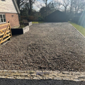 Gravelled Driveway with Tarmac Apron and Cobble Sett Border in…