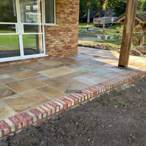Indian Sandstone Patio with New Brick Wall in Ashford, Kent