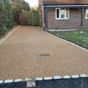 Resin Bound Driveway with Cobbled Edge and Sleeper Wall in…