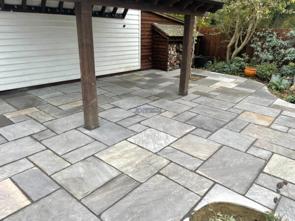 Raised indian sandstone patio with brick wall and steps in ashford kent 8.jpeg