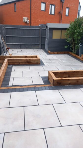 Porcelain patio with brick border and flowerbeds in ashford, kent (5)